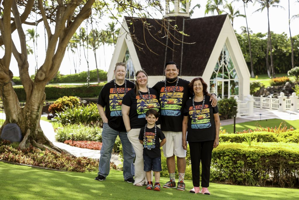 Multigenerational picture of grandparents, parents, grandchild vacationing together to illustrate multigenerational living and to display Bridges to Understanding owner's family.